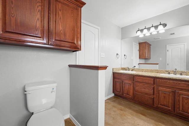 4910 Rio Grande Ave, Midland, TX 79707 - full bathroom featuring double vanity and toilet