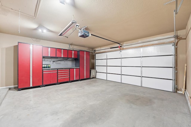 4910 Rio Grande Ave, Midland, TX 79707 - garage featuring a garage door opener and baseboards