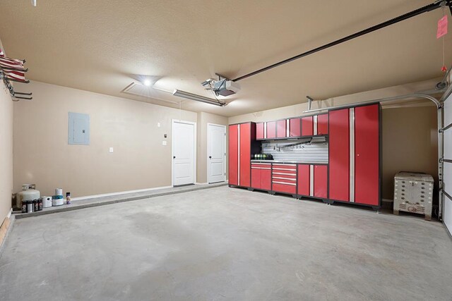 4910 Rio Grande Ave, Midland, TX 79707 - garage featuring electric panel and a garage door opener