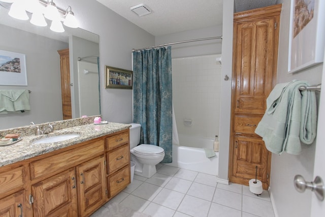 full bath with shower / tub combo, toilet, tile patterned floors, a textured ceiling, and vanity