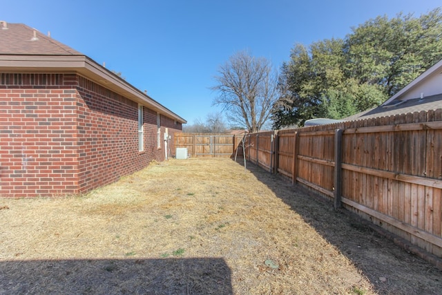 view of yard with a fenced backyard