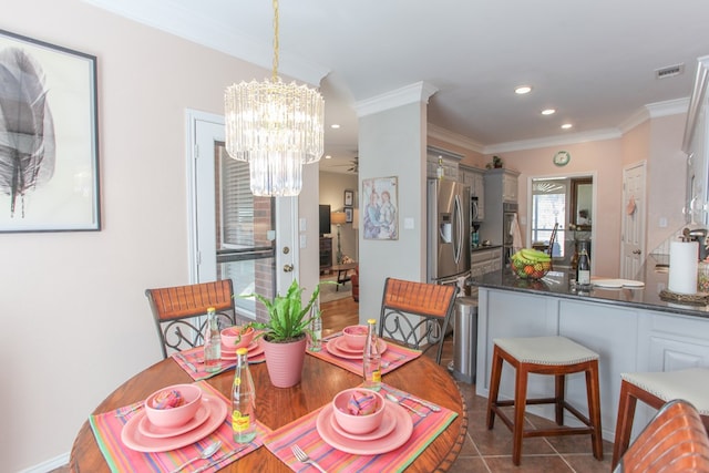 dining room with recessed lighting, dark tile patterned floors, visible vents, an inviting chandelier, and crown molding