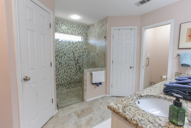 full bath featuring a stall shower, visible vents, and vanity