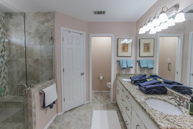 full bath with double vanity, visible vents, toilet, a sink, and a shower stall