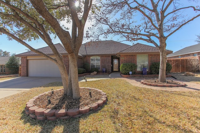 single story home featuring a front lawn, brick siding, and an attached garage