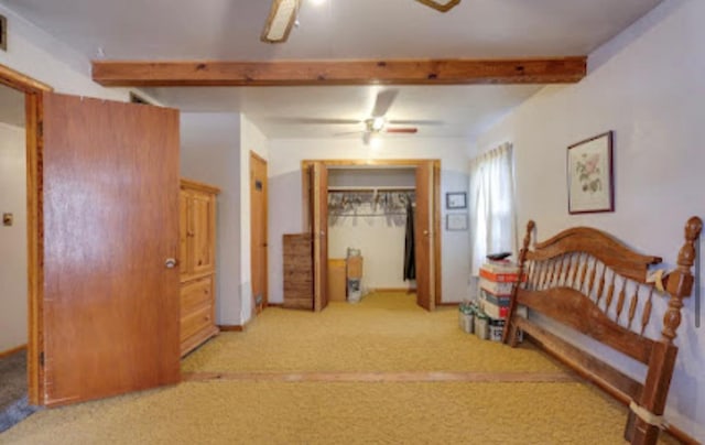 1518 Stadium Ave, Big Spring, TX 79720 - bedroom featuring light carpet and beamed ceiling