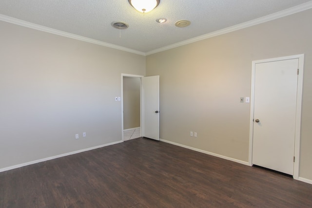 unfurnished room featuring a textured ceiling, dark hardwood / wood-style flooring, and crown molding