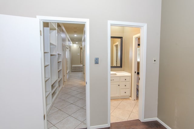 corridor featuring light tile patterned floors