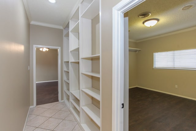 spacious closet featuring tile patterned floors