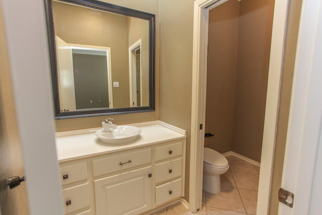 bathroom featuring tile patterned floors, toilet, and vanity