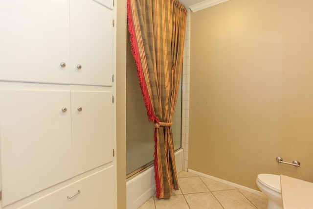 bathroom featuring tile patterned floors, toilet, and shower / bath combination with curtain