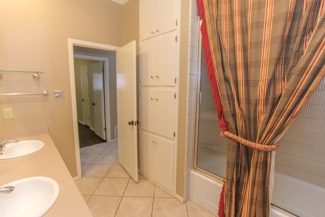 bathroom featuring vanity, shower / bath combination with glass door, and tile patterned flooring