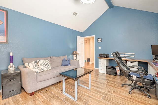 office space featuring high vaulted ceiling, visible vents, beam ceiling, and wood finished floors