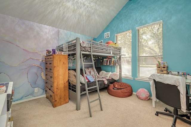carpeted bedroom with baseboards and lofted ceiling