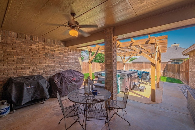 view of patio featuring outdoor dining area, a fenced backyard, a ceiling fan, and area for grilling