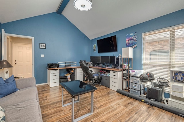 office area featuring lofted ceiling with beams and wood finished floors