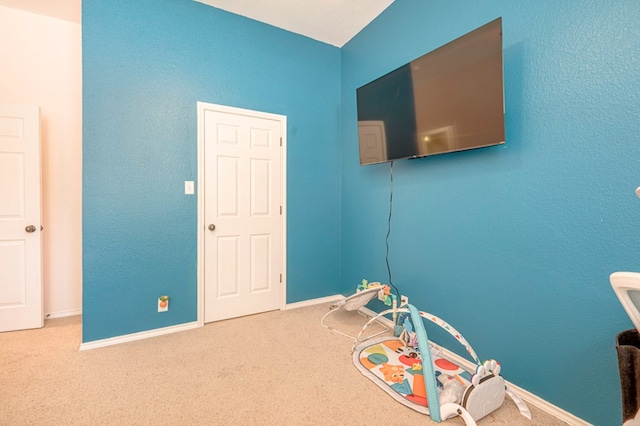 game room with carpet floors and baseboards