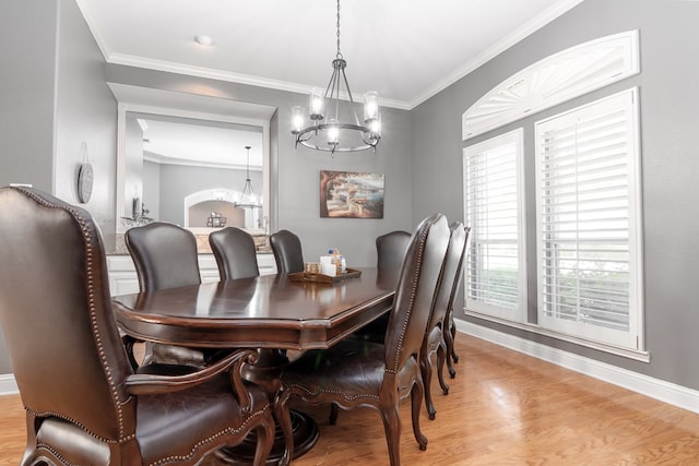 4204 Baybrook Pl, Midland, TX 79707 - dining space with a chandelier, light wood-style flooring, and ornamental molding