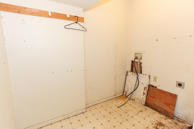 1405 Runnels St, Big Spring, TX 79720 - laundry room with electric dryer hookup, light flooring, and hookup for a washing machine