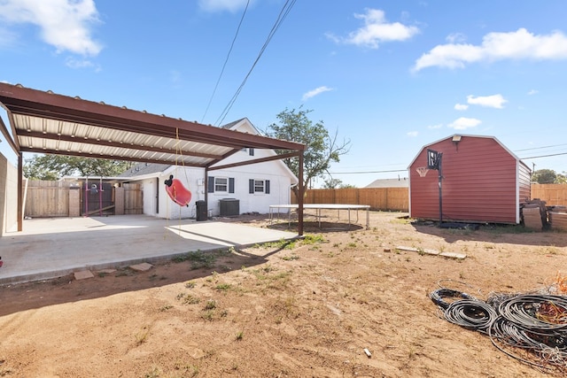 101 Waverly Dr, Midland, TX 79703 - fenced backyard with a trampoline and a shed