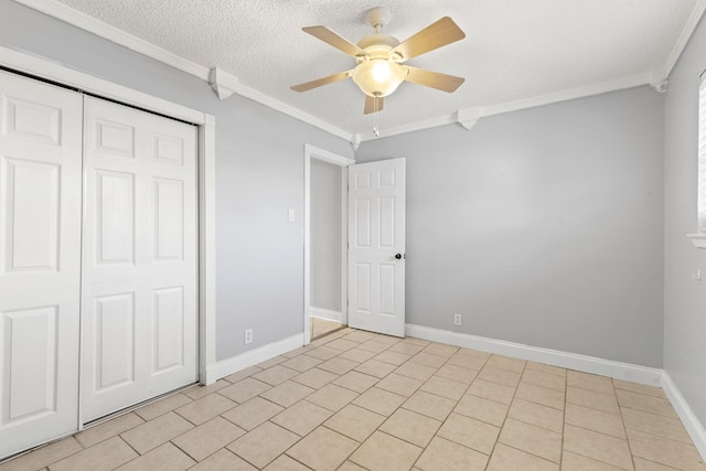 101 Waverly Dr, Midland, TX 79703 - unfurnished bedroom with crown molding, a closet, a ceiling fan, a textured ceiling, and light tile patterned floors
