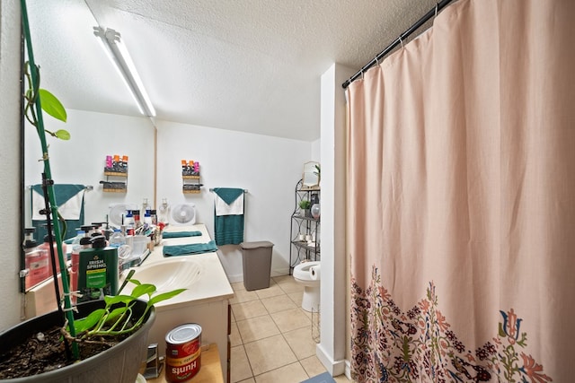 601 Caylor Dr, Big Spring, TX 79720 - full bathroom with vanity, tile patterned flooring, a textured ceiling, and a shower with curtain