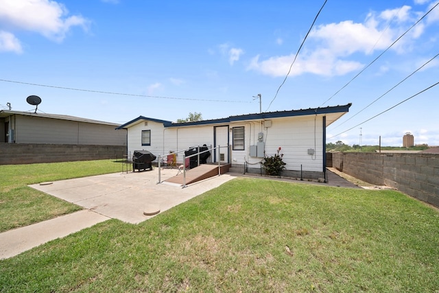601 Caylor Dr, Big Spring, TX 79720 - rear view of house featuring a fenced backyard and a patio area