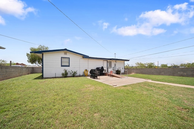 601 Caylor Dr, Big Spring, TX 79720 - rear view of house featuring a patio area and a fenced backyard