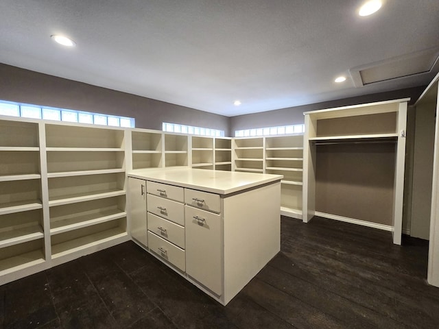 3410 Humble Ave, Midland, TX 79707 - walk in closet with attic access and dark wood-style flooring
