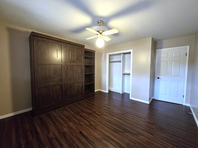 3410 Humble Ave, Midland, TX 79707 - unfurnished bedroom with dark wood finished floors, baseboards, a ceiling fan, and a closet