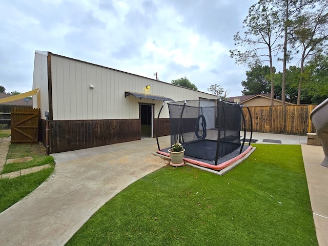 3410 Humble Ave, Midland, TX 79707 - back of property featuring a trampoline and a patio