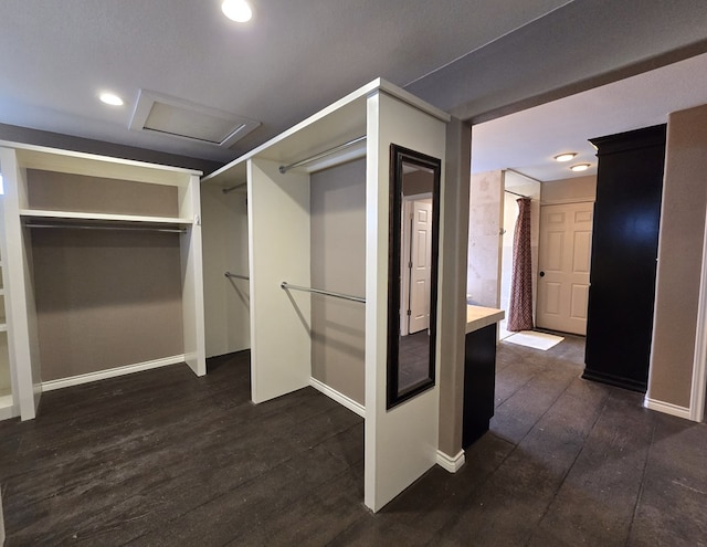 3410 Humble Ave, Midland, TX 79707 - walk in closet with attic access and dark wood-type flooring