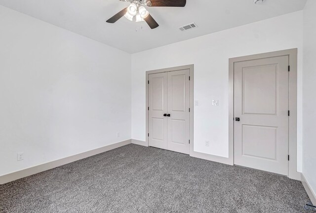 603 S Benton, Midland, TX 79701 - unfurnished bedroom with dark carpet, a ceiling fan, a closet, and baseboards
