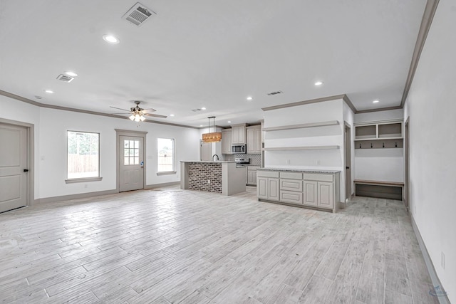 603 S Benton, Midland, TX 79701 - unfurnished living room featuring crown molding, a ceiling fan, baseboards, recessed lighting, and light wood-style floors