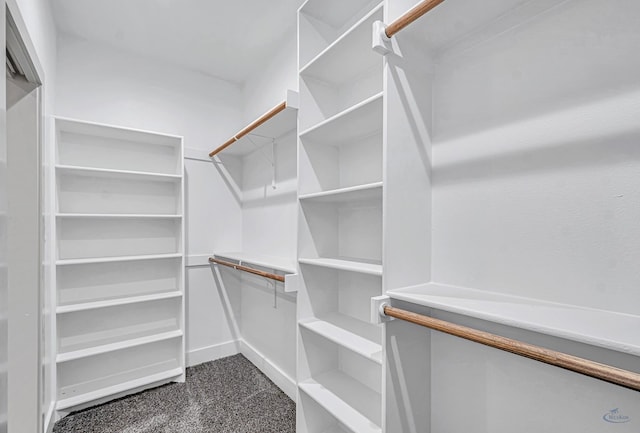 603 S Benton, Midland, TX 79701 - walk in closet featuring dark carpet