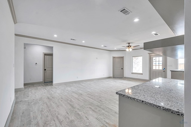 603 S Benton, Midland, TX 79701 - unfurnished living room with ceiling fan, light wood-style floors, baseboards, and recessed lighting