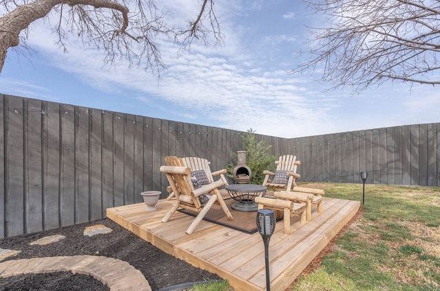 wooden deck featuring a fireplace