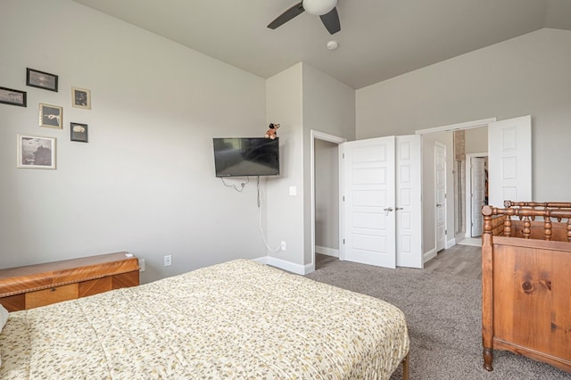carpeted bedroom with baseboards, ceiling fan, and lofted ceiling