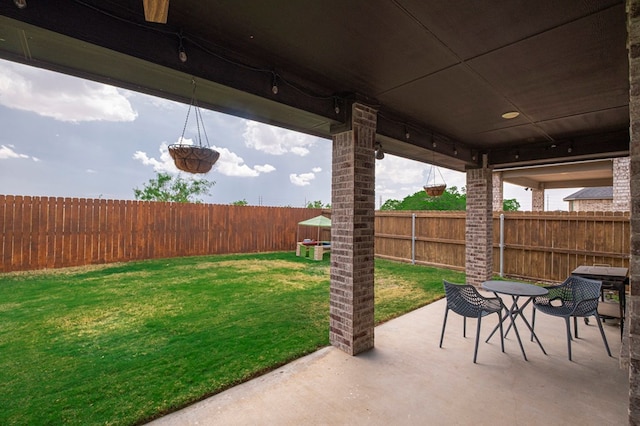 view of patio / terrace featuring outdoor dining area and a fenced backyard
