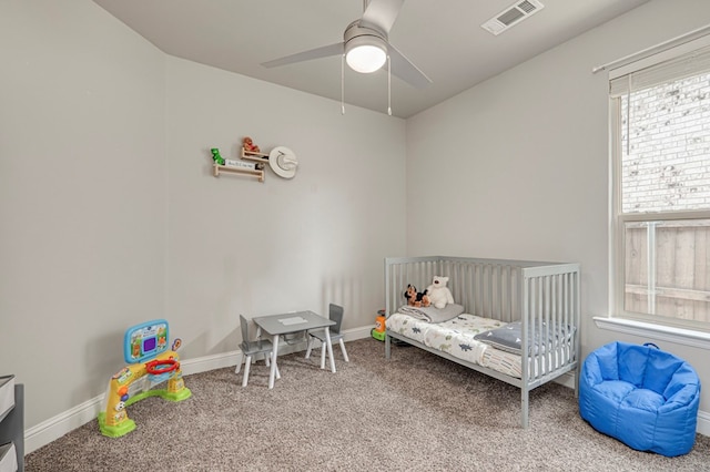bedroom with baseboards, ceiling fan, carpet flooring, and visible vents