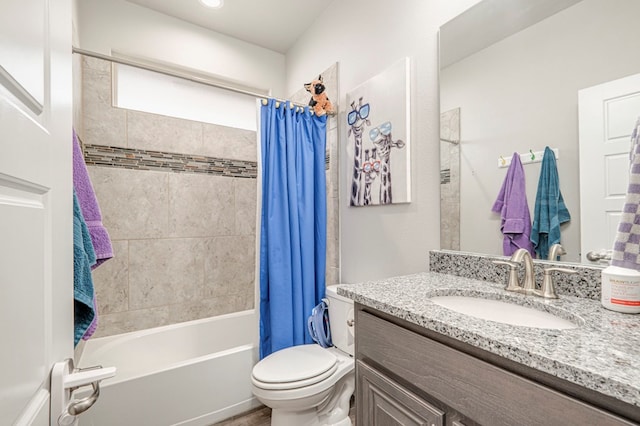 full bathroom featuring vanity, shower / bath combo, and toilet