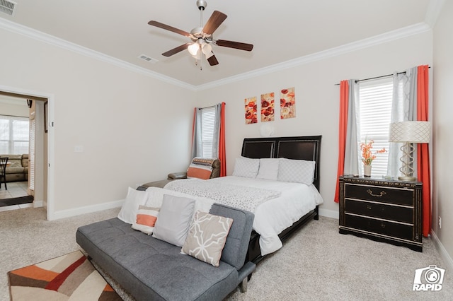 bedroom with light colored carpet, visible vents, baseboards, and multiple windows