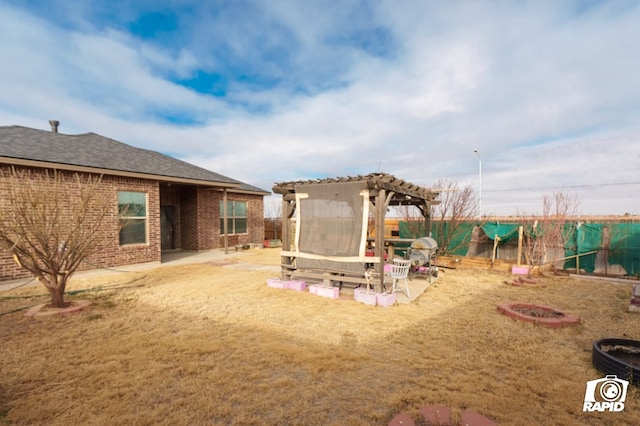 view of yard featuring fence private yard, a patio area, and a pergola