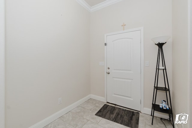 doorway to outside with baseboards and crown molding