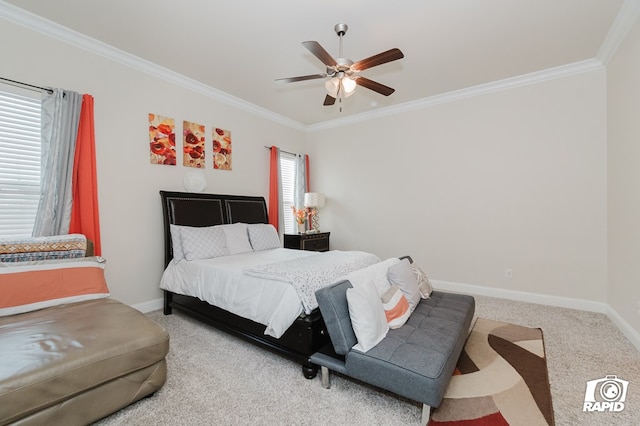 bedroom featuring baseboards, carpet floors, ceiling fan, and crown molding