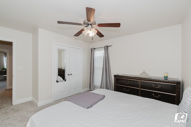 bedroom featuring a ceiling fan, light colored carpet, and baseboards