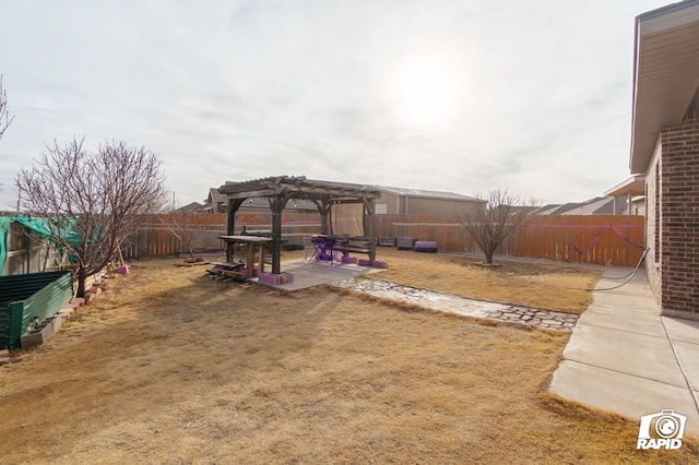 view of yard featuring a fenced backyard, a patio, and a pergola