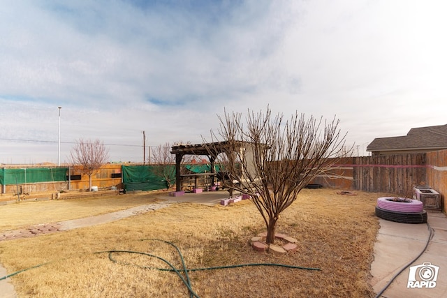 view of yard featuring a fenced backyard and a pergola