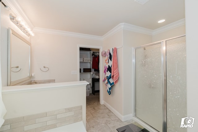 bathroom with vanity, baseboards, a shower stall, a walk in closet, and crown molding