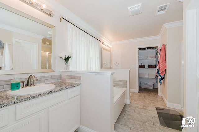 full bathroom featuring vanity, a garden tub, visible vents, and crown molding